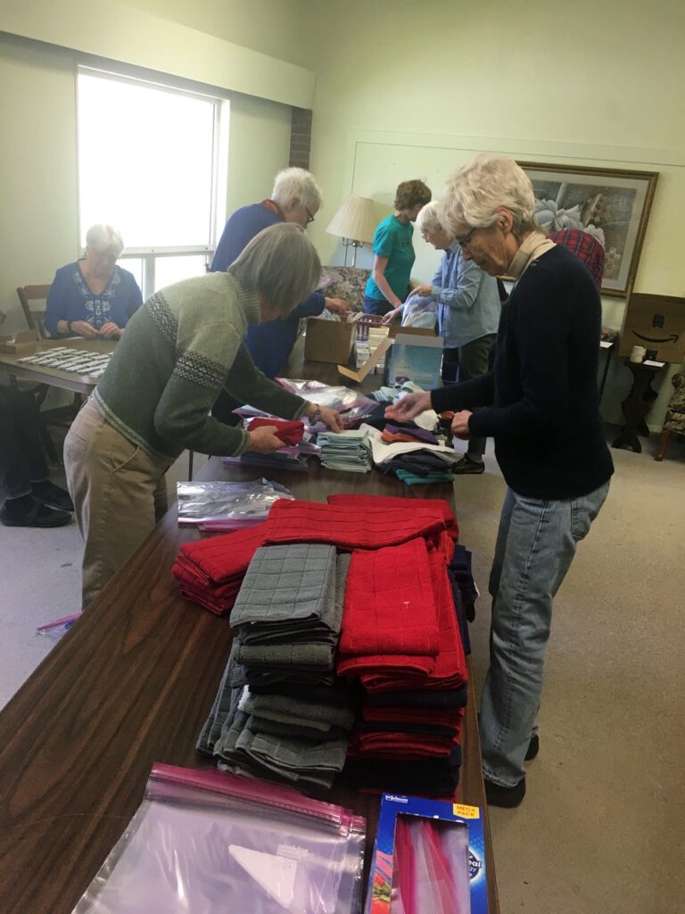 Group of people assembling hygiene kits