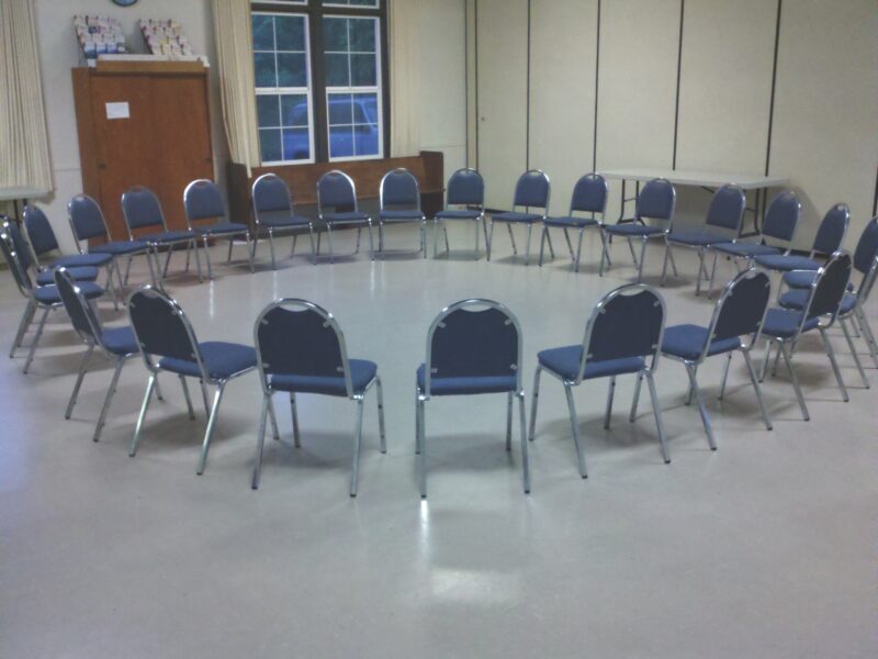 A circle of empty chairs
