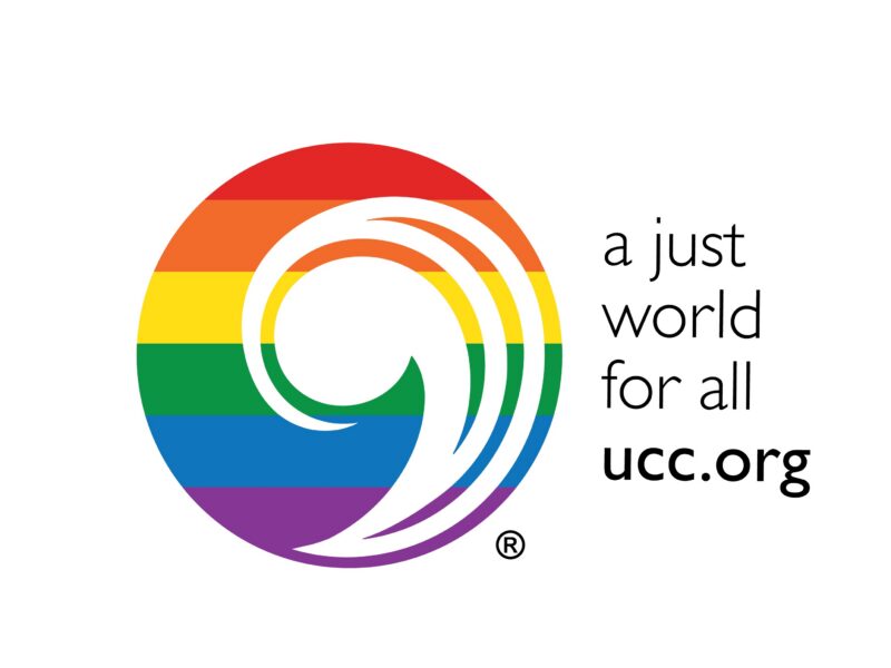 stylized comma, painted in colors of rainbow with words "a just world for all " ucc.org